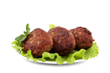 Meat patties with fresh lettuce on a white background.