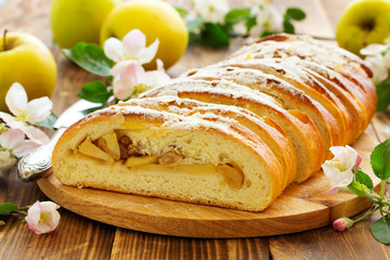 Apple pie dough with raisins in a roll.