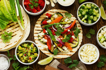 Vegetarian snack tacos with grilled vegetables and salsa.