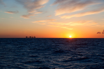 Oil platform in sunrise time