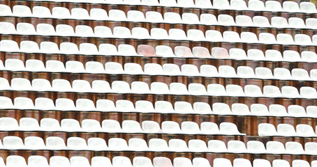 white plastic chairs in the stadium of football