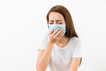 Young lady sneeze with face mask