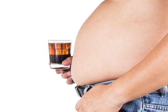 Man with big belly holding a glass of fizzy soda