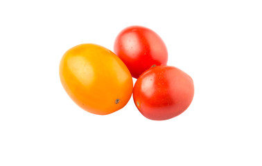 Yellow and red grape tomato over white background