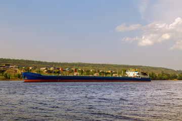 cargo ship tanker sailing along the coast.