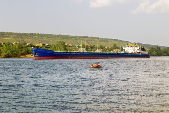 cargo ship tanker sailing along the coast.