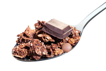 Spoon with chocolate muesli isolated.