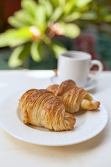 Closeup Fresh Croissant and coffee 