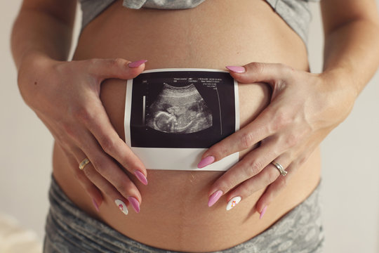 Model, woman, blonde, pregnant in the interior