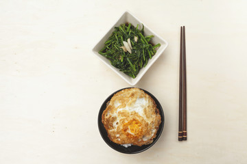Fried vegetable and rice with crispy fried egg 