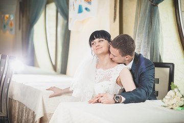 Bride and groom sitting at the table