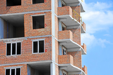 Building construction site work against blue sky