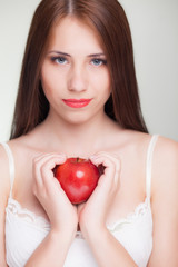 beautiful girl with red apple and smile