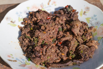 Chopped Beef Cooked in Northeastern Style on the white dish