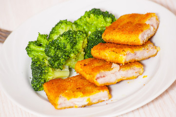 fried breaded fish fillets with broccoli