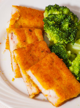 Fried Breaded Fish Fillets With Broccoli