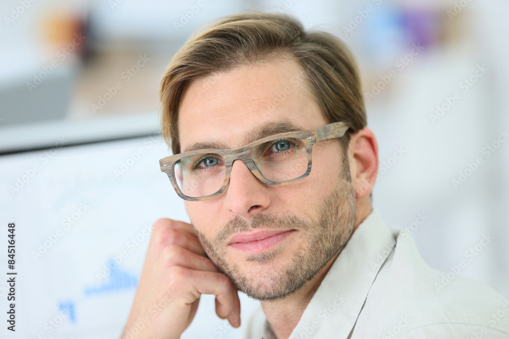 Wall mural Portrait of man with mordern eyeglasses on