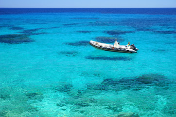 Crystal clear water with Boat