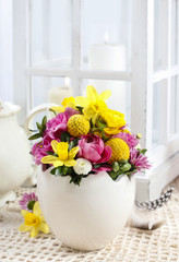 Easter floral arrangement in white egg shell