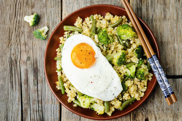 stir fried millet with broccoli, green beans and fried egg