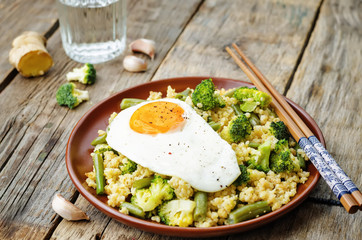 stir fried millet with broccoli, green beans and fried egg
