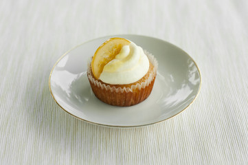 Single lemon cupcake on the little plate