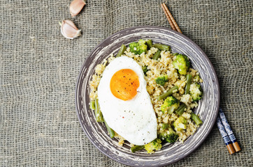 stir fried millet with broccoli, green beans and fried egg