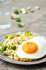 stir fried millet with broccoli, green beans and fried egg