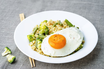 stir fried millet with broccoli, green beans and fried egg