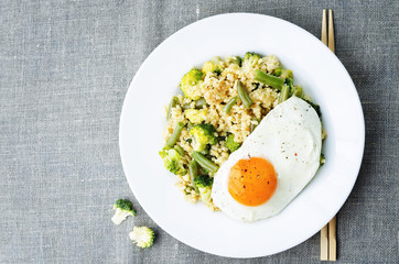stir fried millet with broccoli, green beans and fried egg