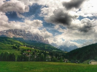 Fototapeta na wymiar Green valley in UNESCO Heritage Site of Dolomites, Italy