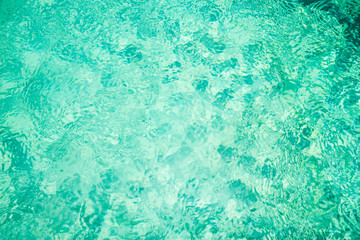 Fototapeta premium Rippling water in a pool. Bright green water background