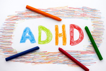 ADHD written on sheet of paper - obrazy, fototapety, plakaty
