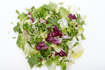  Green and red leaf of lettuce . Isolated on a white background