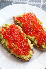 Sandwich with avocado and caviar