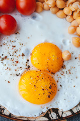 Scrambled eggs with chickpeas and cherry tomatoes