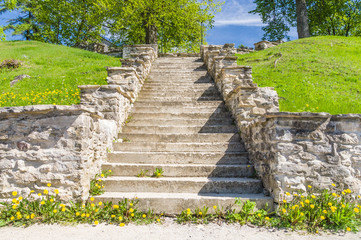 Medieval concrete stair in sunny springtime park