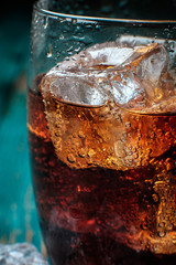 Glass of cola with ice. Close-up