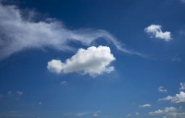 White clouds on clear blue sky