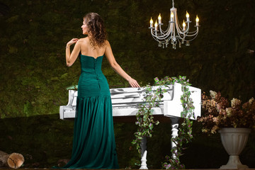 Gorgeous girl near piano