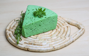 Green pesto cheese and basil leaves