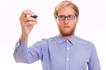 Young man writing on transparent board