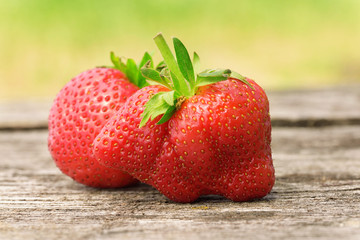 Ripe strawberries on wooden background