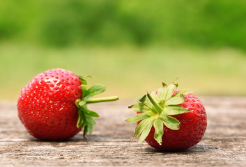 Ripe strawberries on wooden background