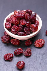 dried cranberries in a small bowl. fruit full of vitamin c.