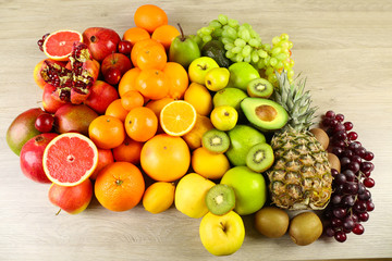 Assortment of exotic fruits on wooden background