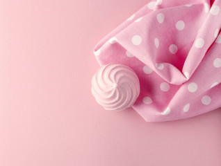 Pink meringue and dotted fabric,