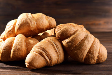 Delicious croissants on table close-up