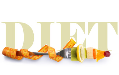 Snack of fruits on fork with measuring tape isolated on white