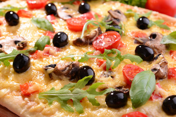Delicious homemade pizza on table close-up